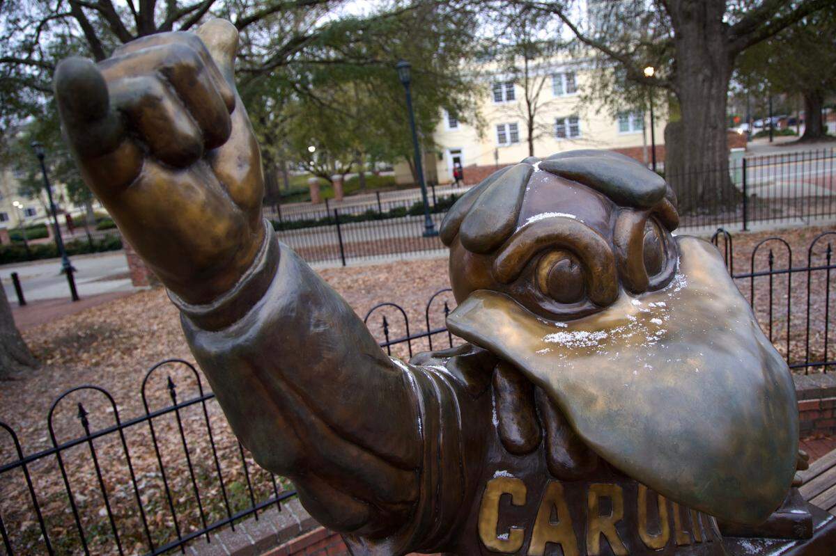 Snow falls on the Cocky statue on the University of South Carolina campuson Jan. 21, 2025.