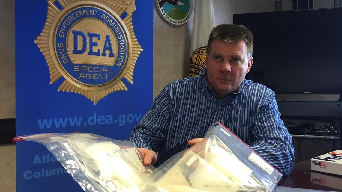DEA Agent Robert Murphy displays what he says is $11,000 worth of heroin.