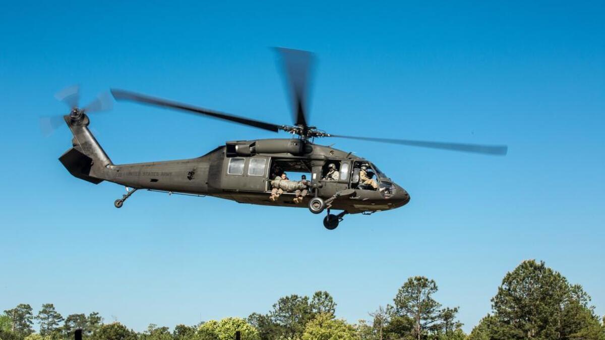 Rangers from Fort Benning fly in a UH-60 Black Hawk helicopter in April. Rangers have been training at McEntire Joint National Guard Base near Eastover. That training will expand to the Poinsett Electronic Combat Range in Wedgefield next week.