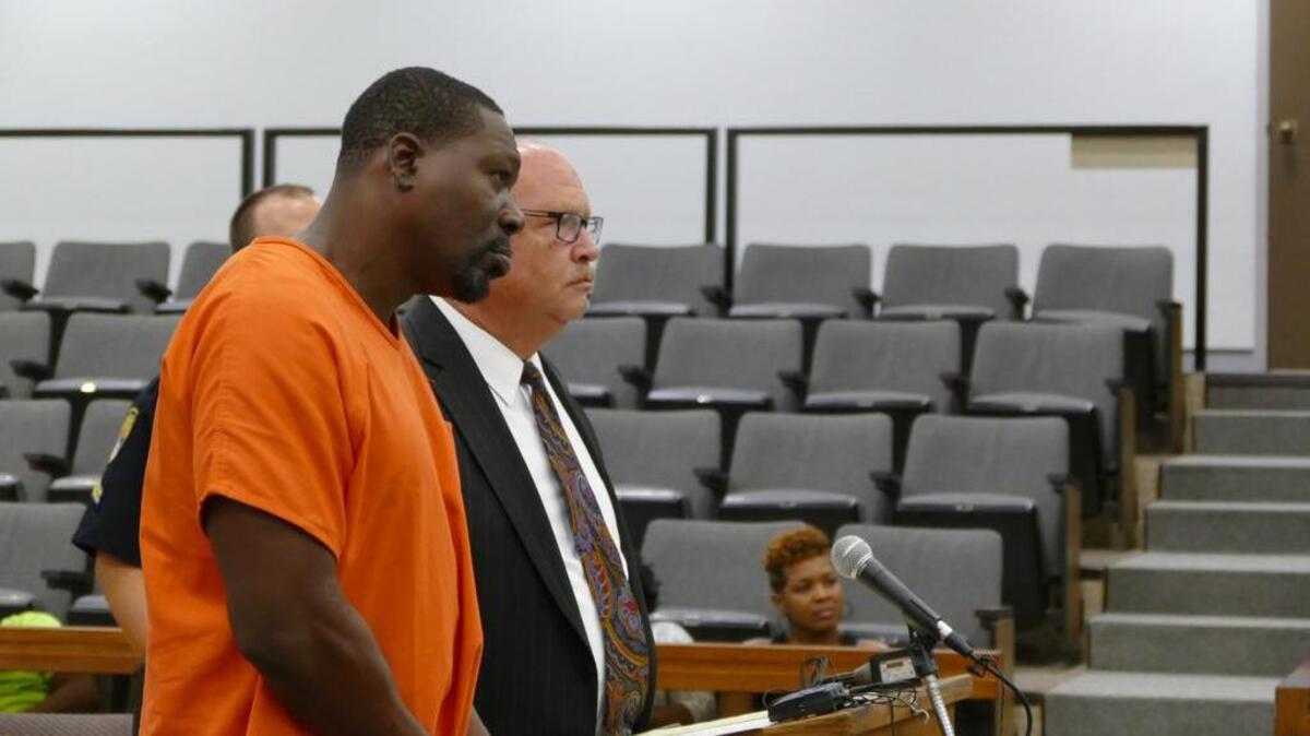 
David Morgan, left, walked out of the courtroom Wednesday while the judge was still addressing him after denying bond on his attempted murder and weapons charges. Morgan, pictured here with Rock Hill attorney Leland Greeley, is accused of shooting at two people outside the Crazy Horse Showclub early Tuesday.
