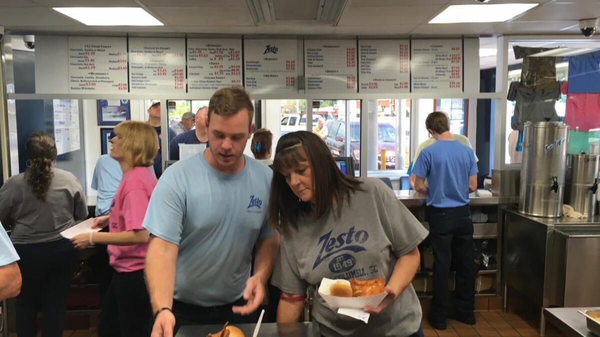 The staff at Zesto in West Columbia serve lunch Thursday.
