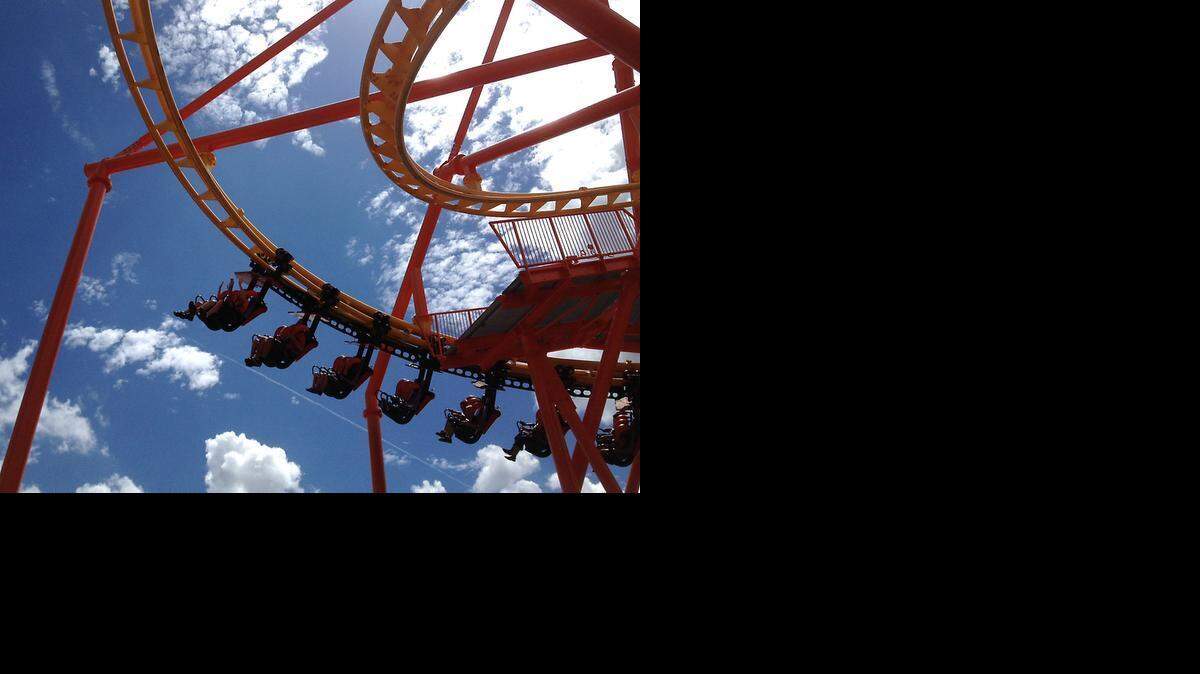 
Riders take the sky on the Flying Ace Aerial Chase coaster at Carowinds in this 2012 file photo. 
