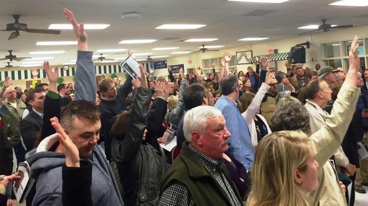 Hundreds of people attended a public input meeting Thursday on a proposed greenway along Gills Creek in Columbia. Here, many of them raise their hands to indicate their support of the greenway.