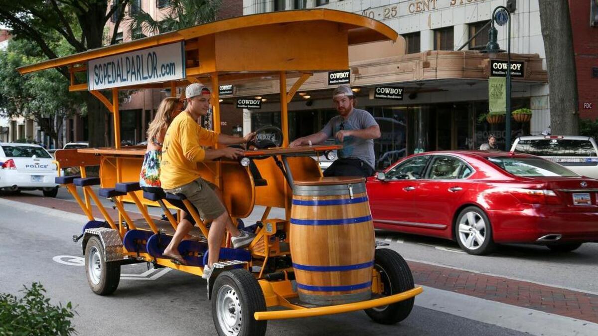 A party bike was one of the featured activities at a First Thursday on Main Street last year. OneColumbia helps promote the event that enlives downtown Columbia.