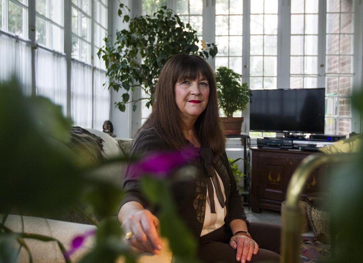 April Lucas poses for a photo in her home located in the University Hill neighborhood. Lucas moved into her home in 1987. Lucas would frequent more than a dozen businesses in Five Points but that has changed since they've left. University Hill sits in between Five Points and the University of South Carolina and has felt the impact of the growing bar scene. Lucas wants to face the issues happening in Five Points. "If you sweep under the rug long enough the problem becomes serious," said Lucas.