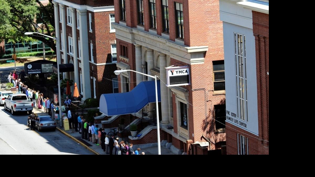 
First Baptist Church members circled their block recently as they prayed about embarking on Project:Next and the purchase and renovation of the adjacent downtown YMCA.
