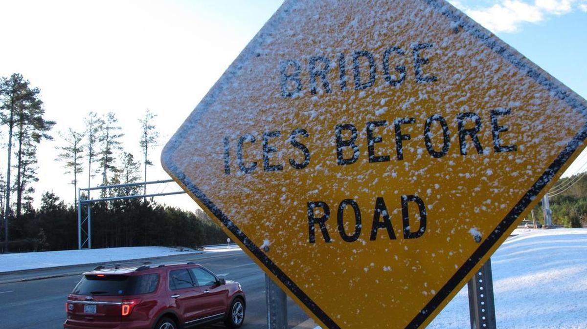 Icy snow plasters a warning sign.