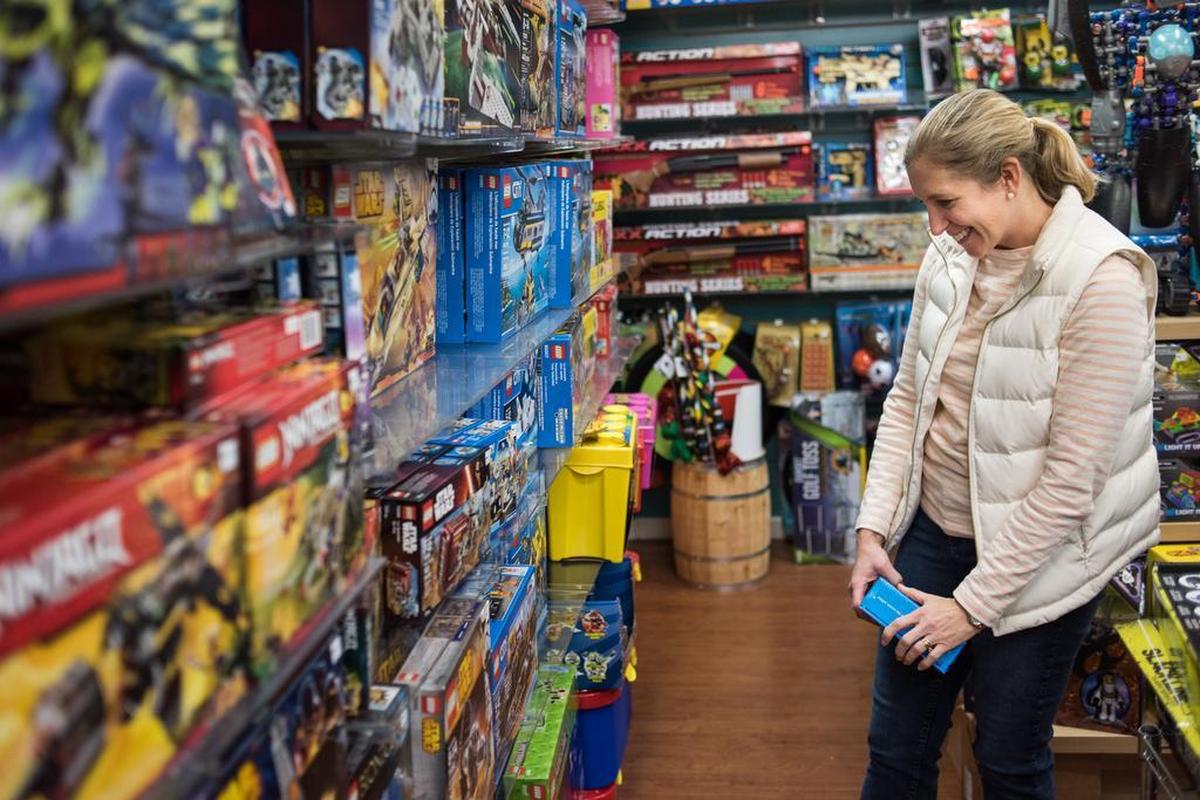 Cydney Milling looks through the Lego section Friday morning at Be Beep a Toy Shop on Forest Drive. The Forest Acres business closed for a few days and suffered from slow traffic during the October flooding. They opened at 8 a.m. and featured a storewide 20 percent off sale on Black Friday.