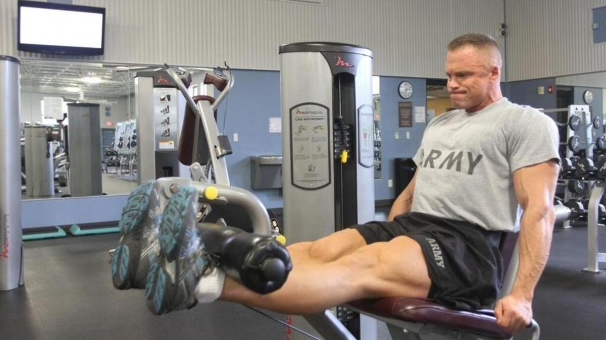 Maj. James Taylor, U.S. Army Central information operations exercise planner, demonstrates an exercise at Shaw Air Force Base, that he believes best benefited his legs to win in the National Physique Committee National All Military Forces Championships. The competition was held in Wilmington, N.C