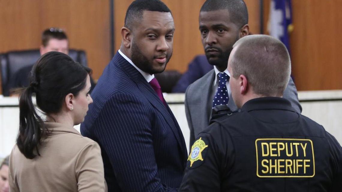 Brian Newman and his attorney Bakari Sellers leave court after Newman’'s court appearance on state tax charges Tuesday.
