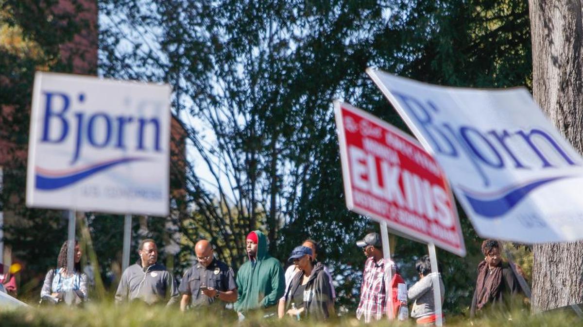 Voters wait in line outside the Richland County election office to cast absentee ballots the Monday before the Nov. 8 election.