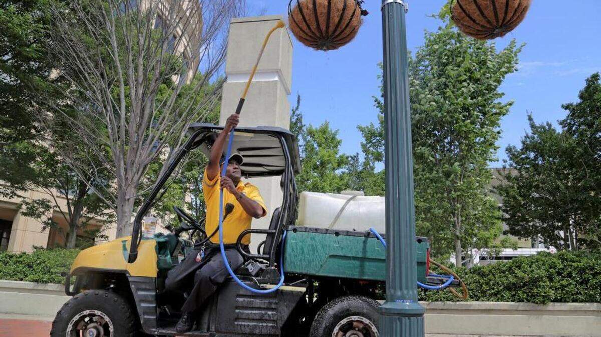 Yellow Shirts, such as this worker on Main Street, may continue to operate in the Vista at least through end of 2016.