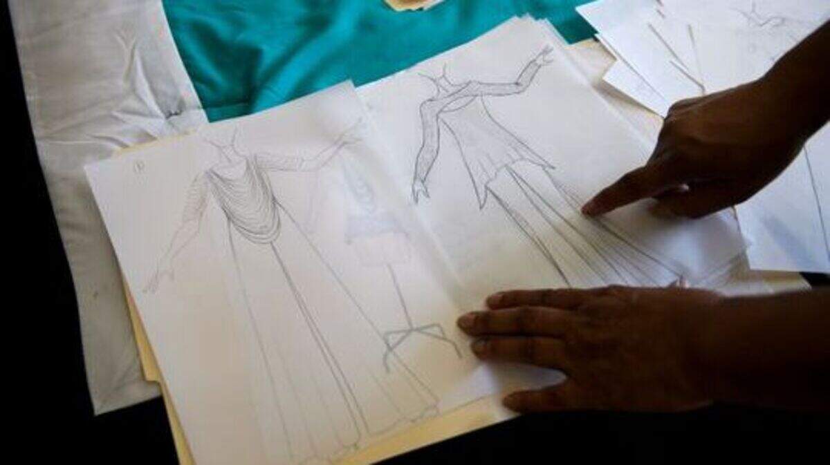 Kitty Black Perkins, former chief fashion designer for Barbie during a 28-year career at Mattel, shows sketches of dresses she has designed on Friday, Jan. 25, 2019.