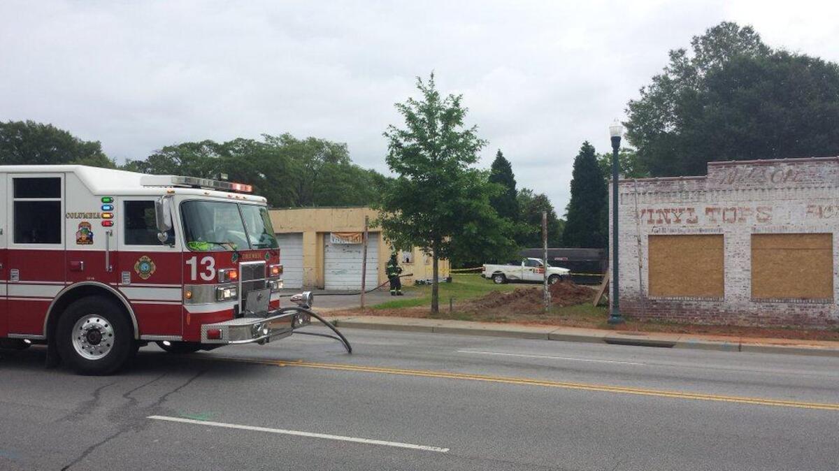 Firefighters work a natural gas rupture on Main Street in Columbia on Tuesday morning.