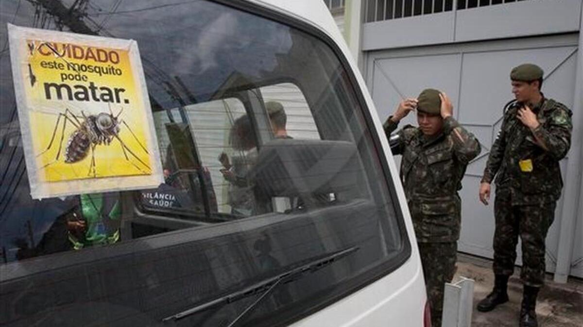 Army soldiers prepare for a clean up operation against the Aedes aegypti mosquito, which is a vector for transmitting the Zika virus, in Sao Paulo, Brazil, Thursday, Jan. 28, 2016. The sticker reads in Portuguese " Beware, this mosquito can kill ".