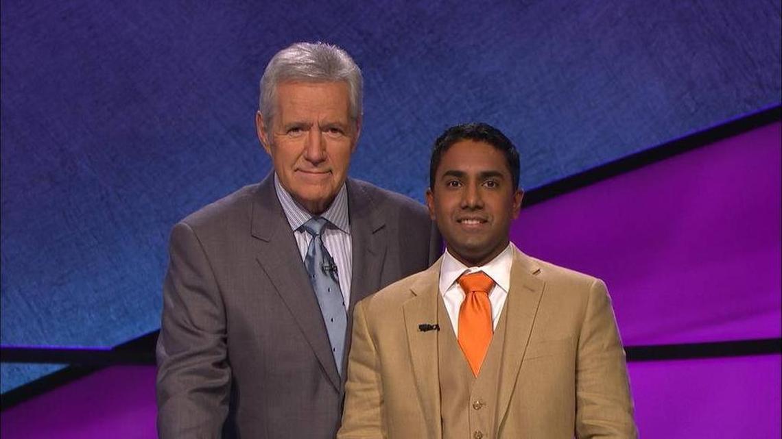 Nilanka Seneviratne, right, poses with ‘Jeopardy’ host Alex Trebek.