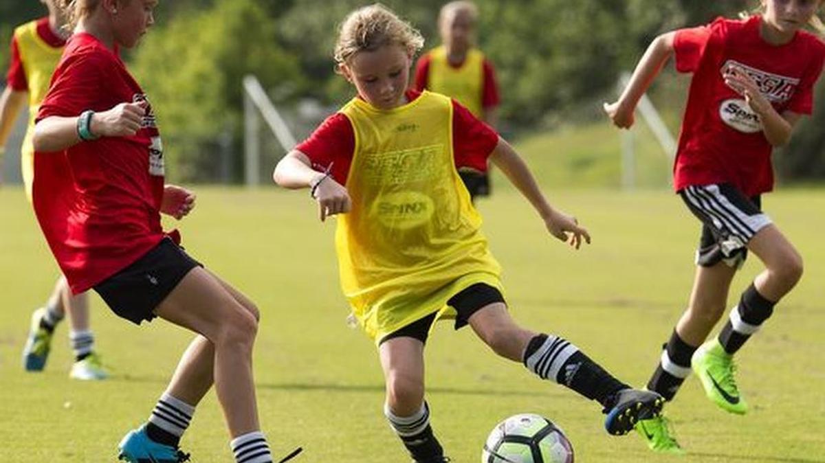 Ellie Pestrak, Rose Finnegan and Riley Bradley of CESA's 10U and 11U girls teams play a practice match at the Wenwood Soccer Complex on Thursday, July 5, 2017.