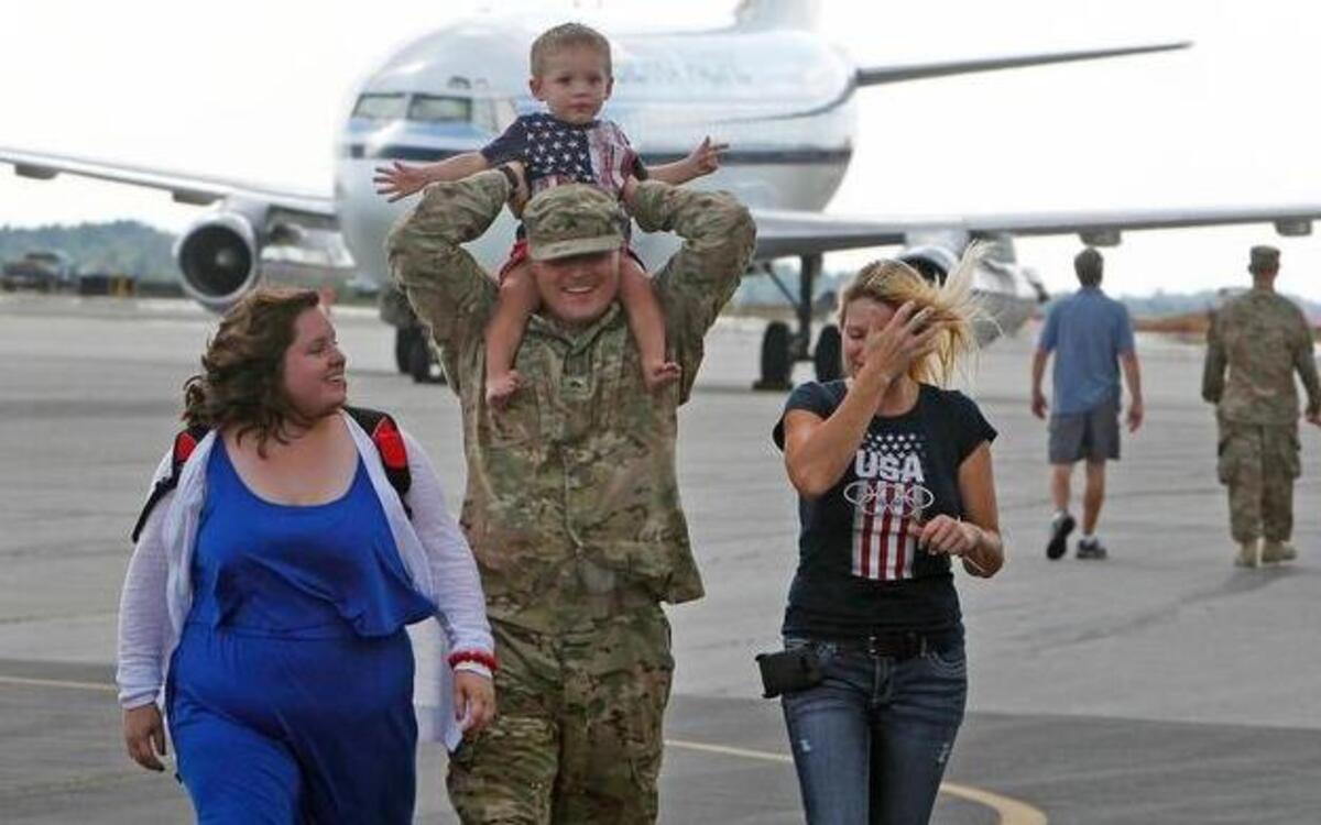 
FILE PHOTO (2014): Families meet returning loved ones from deployment overseas. 
