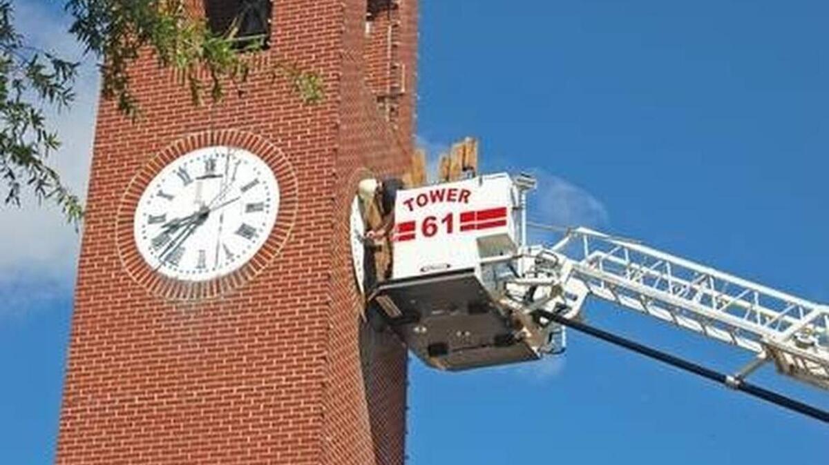 
Workers remove the hands and face from the Spartanburg clock tower late last month.
The clock is being renovated in a $23,000 project to update the landmark clock tower, whose clock and bell were installed in the old opera house in downtown during the early 1880s.

