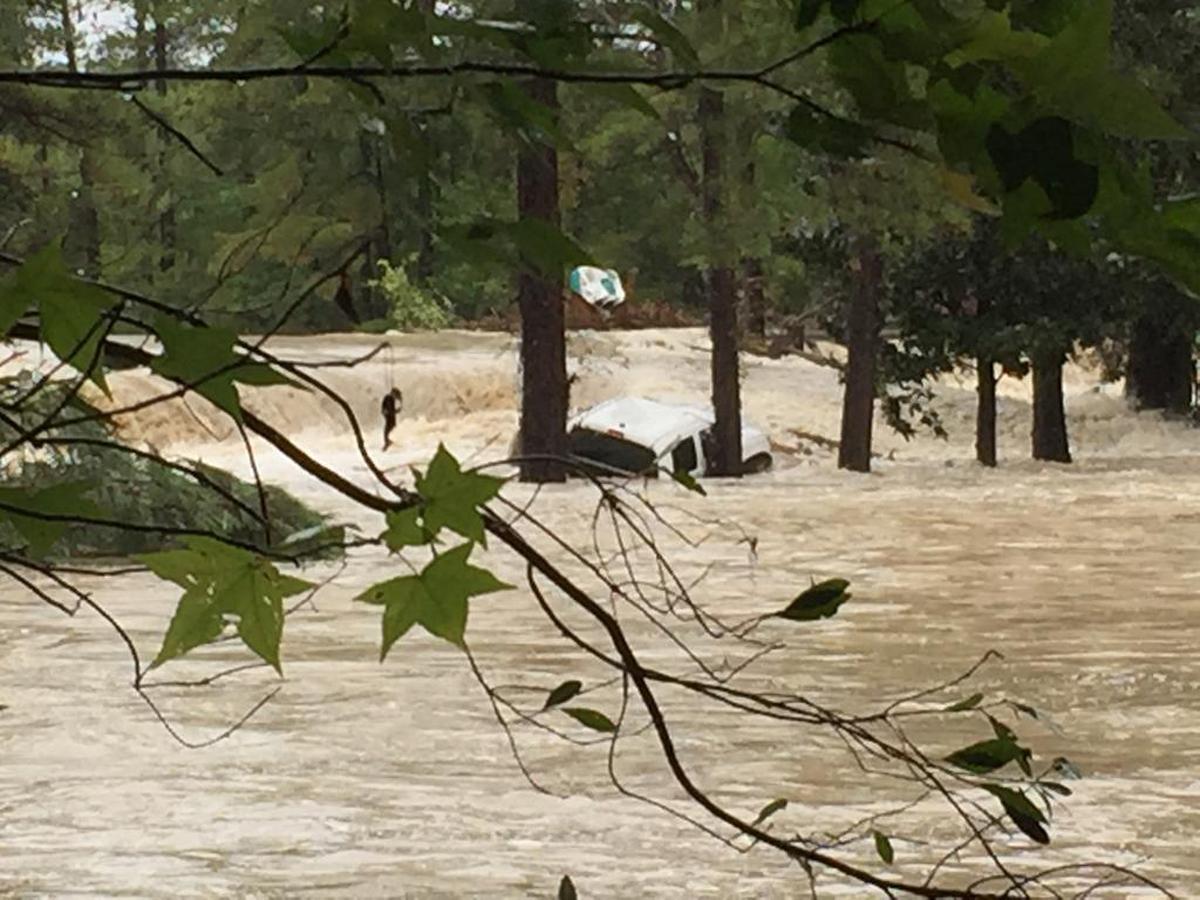 Flood waters from a historic October 2015 flood cover the dam at Spring Lake in Richland County. A truck was washed into Forest Lake from a road that ran across the top of the Spring Lake dam. The dam has since been repaired.