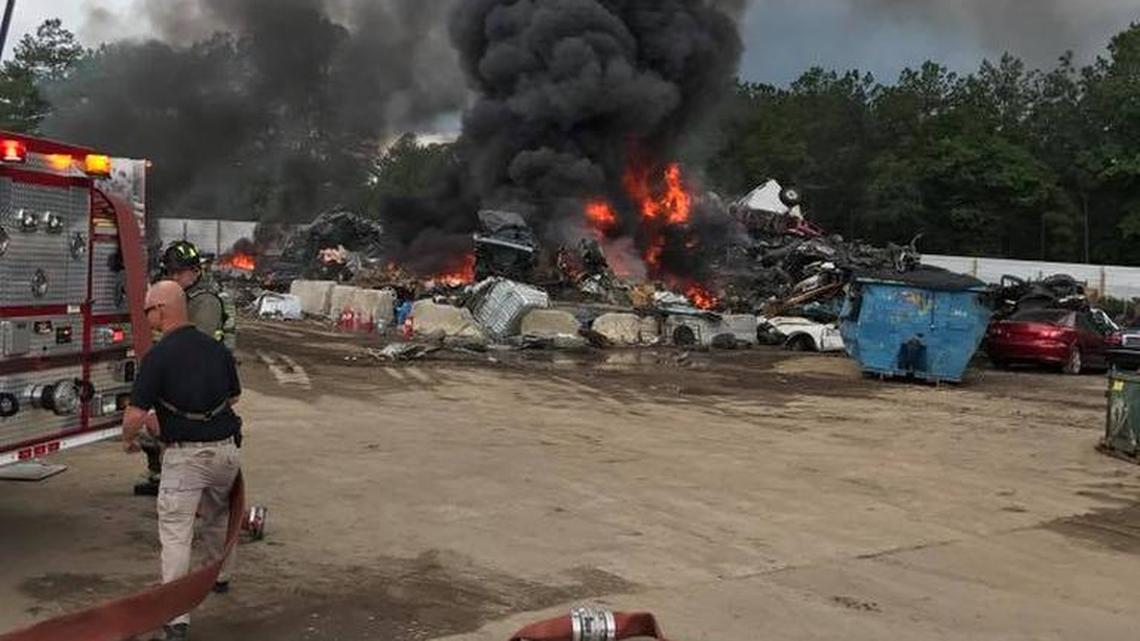 Firefighters from three agencies responded to a large blaze at a Cayce salvage yard Monday.