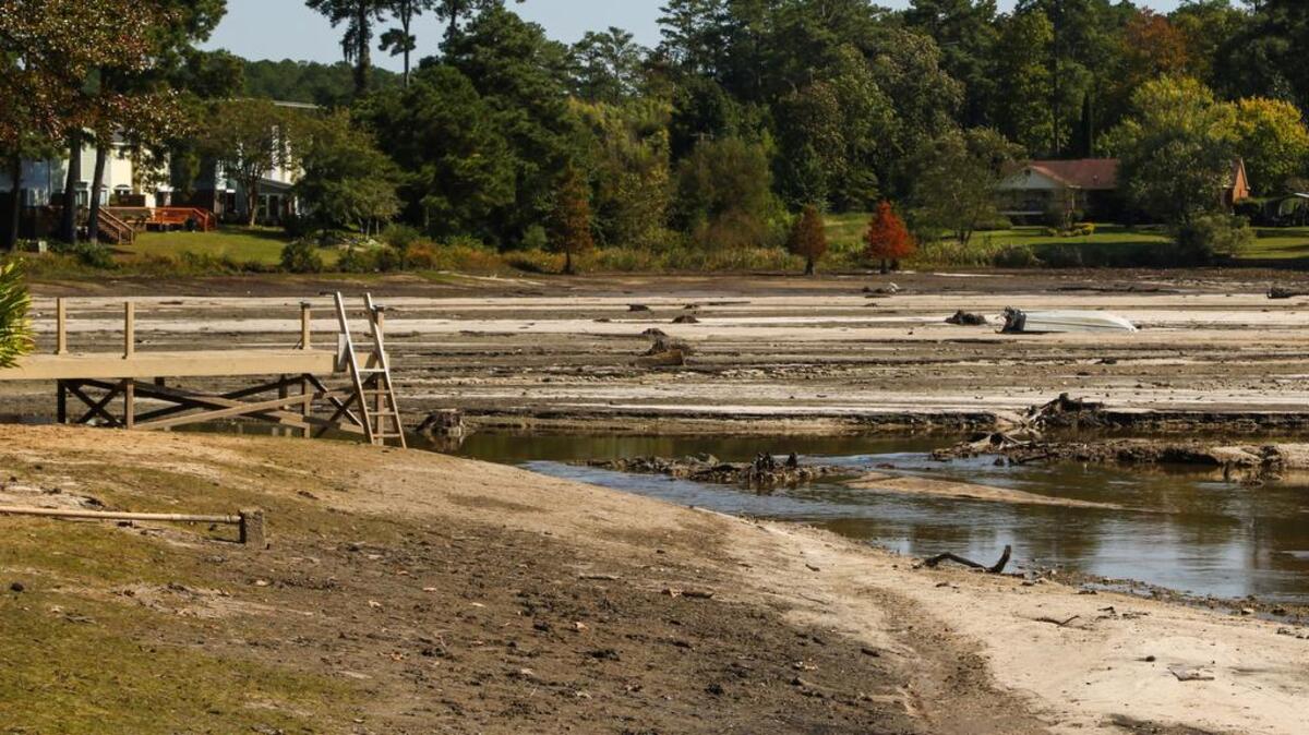 Cary Lake is a muddy plain after a massive rain storm burst the dam north of Columbia.