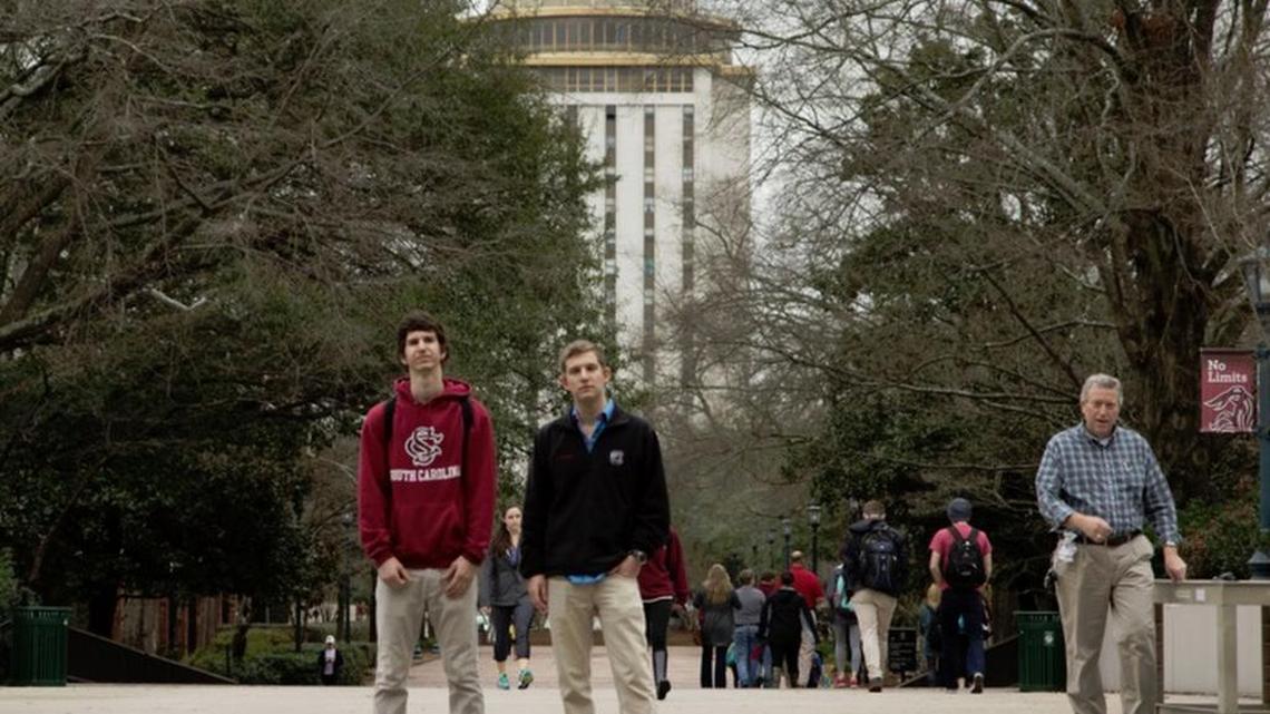 Ross Abbott, right, and Michael Kriete are University of South Carolina students who had to explain their decision to show posters that questioned freedom of speech limits at public universities. Abbott on Tuesday sued USC even though it did not follow through with threatened disciplinary action after some students complained about the posters.