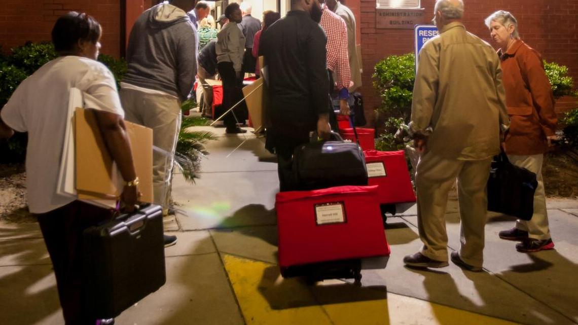 Richland County poll workers lined up last fall to deliver election results to county elections headquarters.