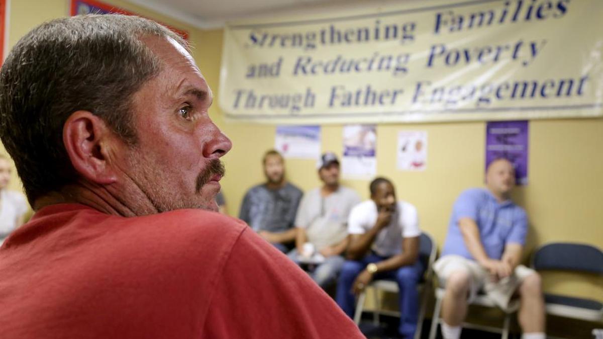 
Wayne Duncan listens to Jermaine Johnson, not pictured, as Johnson leads a Midlands Fatherhood Coalition meeting about financial stability and economic development.
