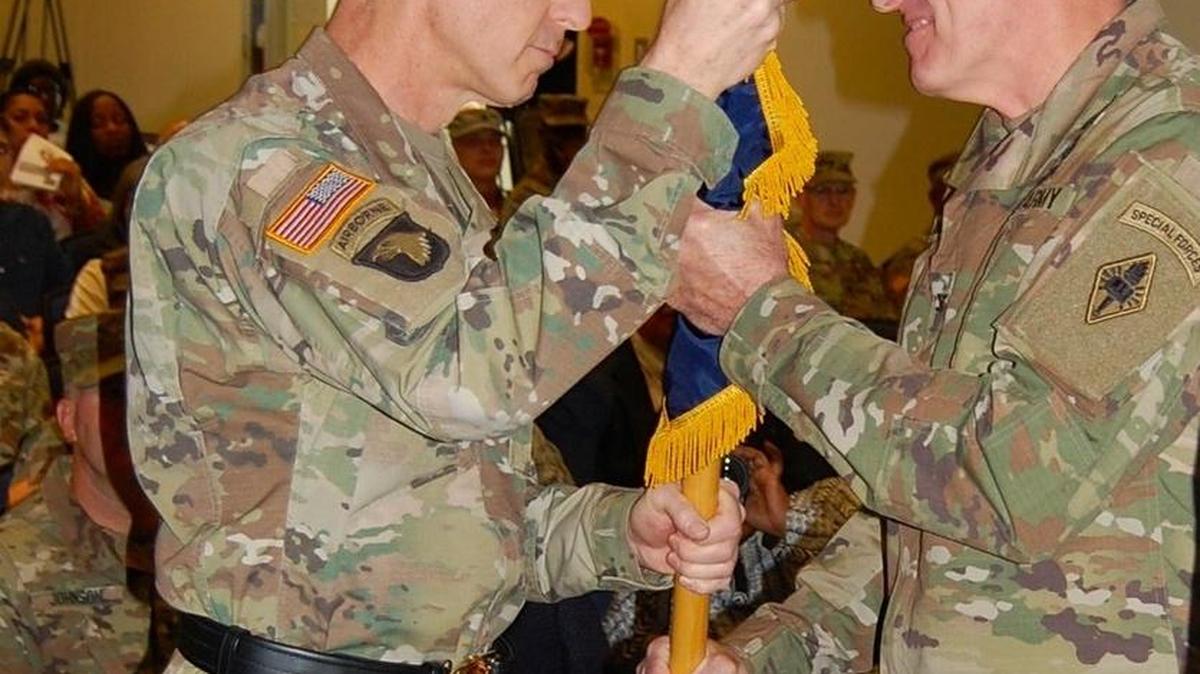 Incoming commandant of the U.S. Army Chaplain Center and school Col. Jeffrey D. Hawkins (right) accepts the colors from Army Chief of Chaplains Maj. Gen. Paul K. Hurley at a ceremony Friday.