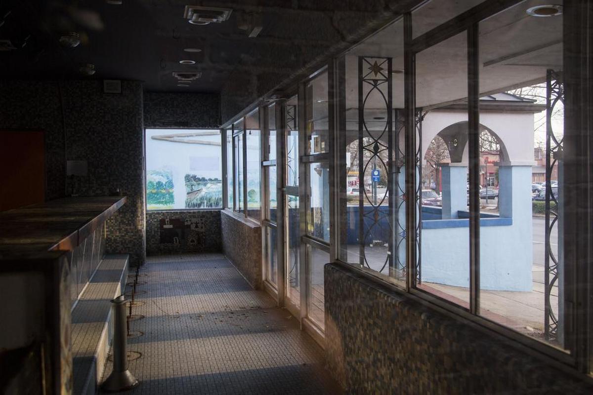Lights shines through the empty storefront of El Burrito on the 900 block of Harden Street in Columbia, SC. The restaurant closed after being sold to Campus + Main, a California investment group, which has plans to develop a mixed use property.