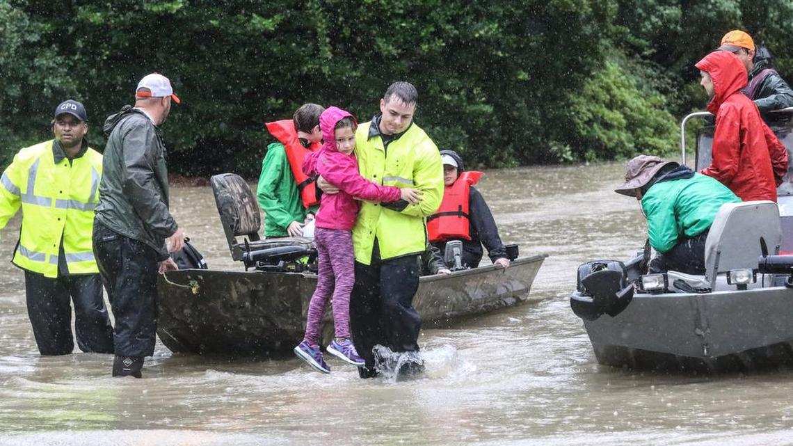 Officials with the Department of Natural Resources make a water rescue in Forest Acres during the Oct. 4 flooding caused by heavy rains.