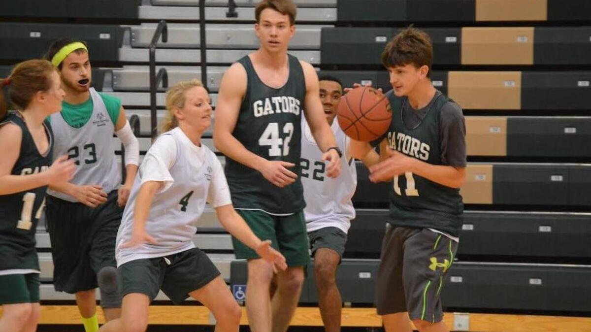Students from River Bluff High School near Lexington play basketball in Special Olympics competition.
