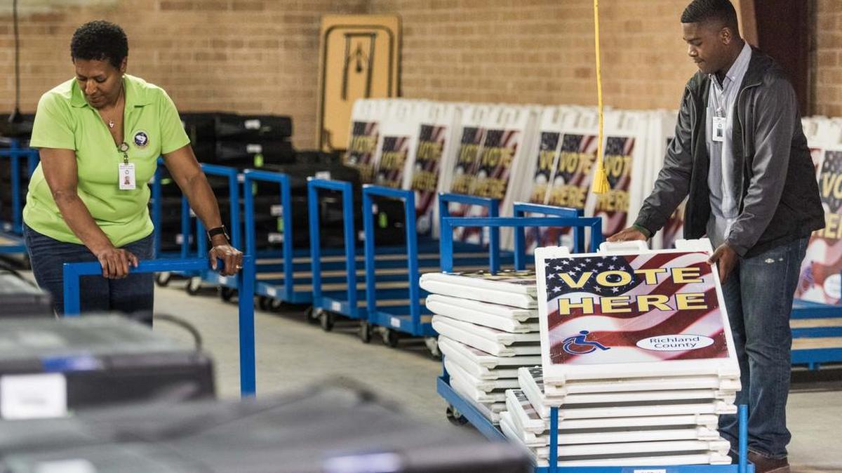 Richland County, SC,  Election Machine Technician Andre McClaine, right, and Election System Coordinator Cheryl Goodwin prepare polling supplies for Election Day on Nov. 8, 2016