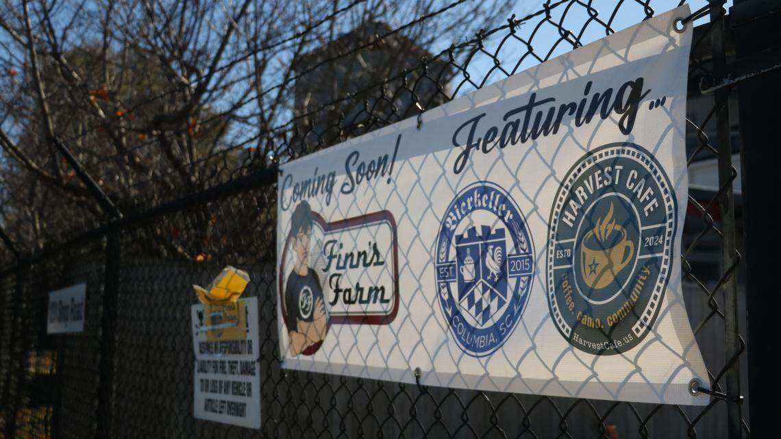 A sign advertises the new Finn’s Farm development in the former home of River Rat Brewery.
