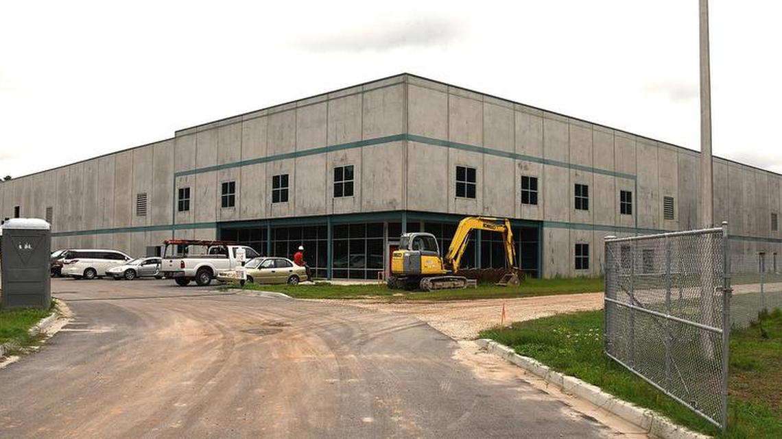 This spec building on North Wise Drive is a beehive of activity as construction crews work on the inside and outside of the building that will house the new company.