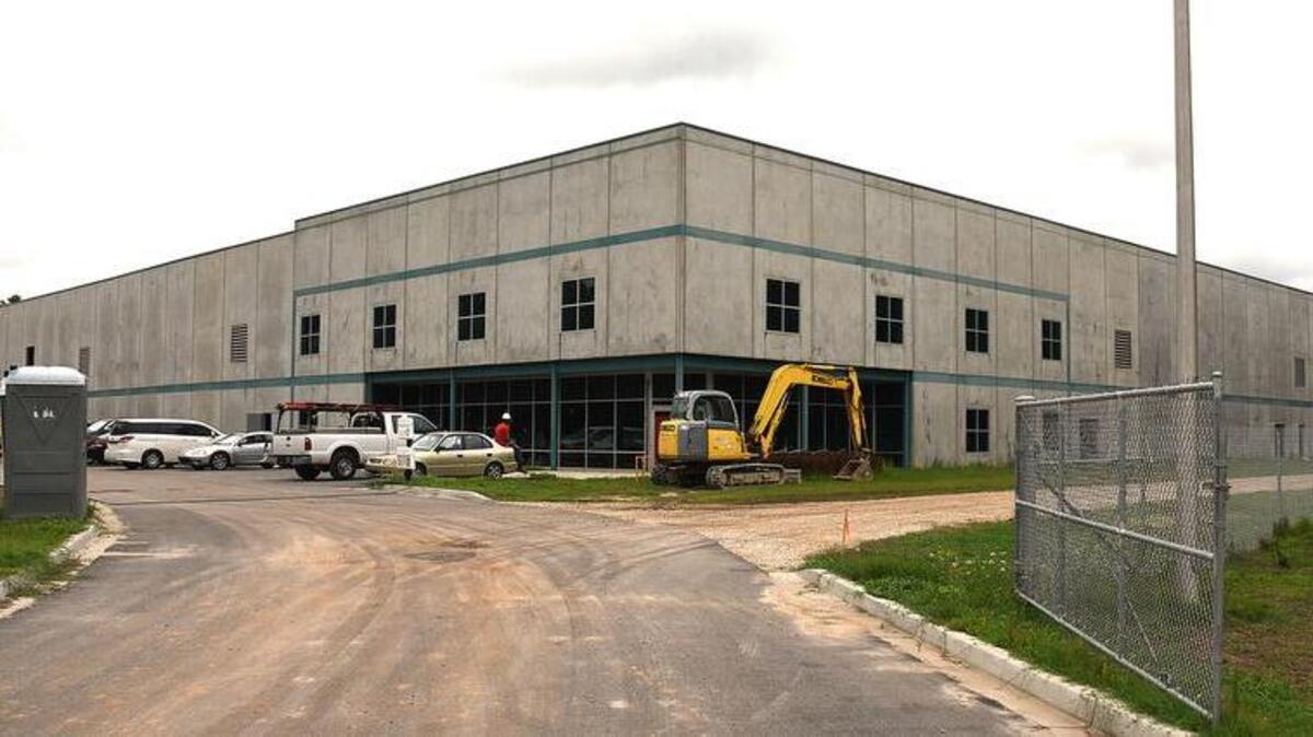 This spec building on North Wise Drive is a beehive of activity as construction crews work on the inside and outside of the building that will house the new company.