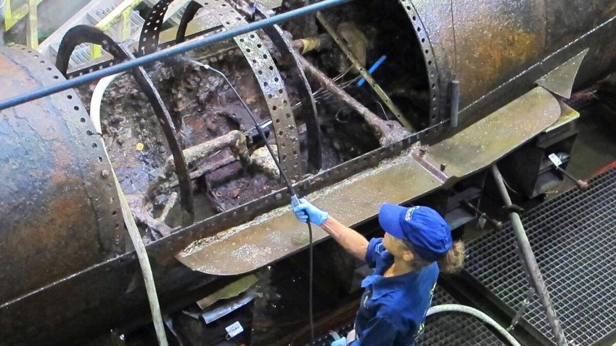 
A conservationist sprays water on the Confederate submarine H.L. Hunley

