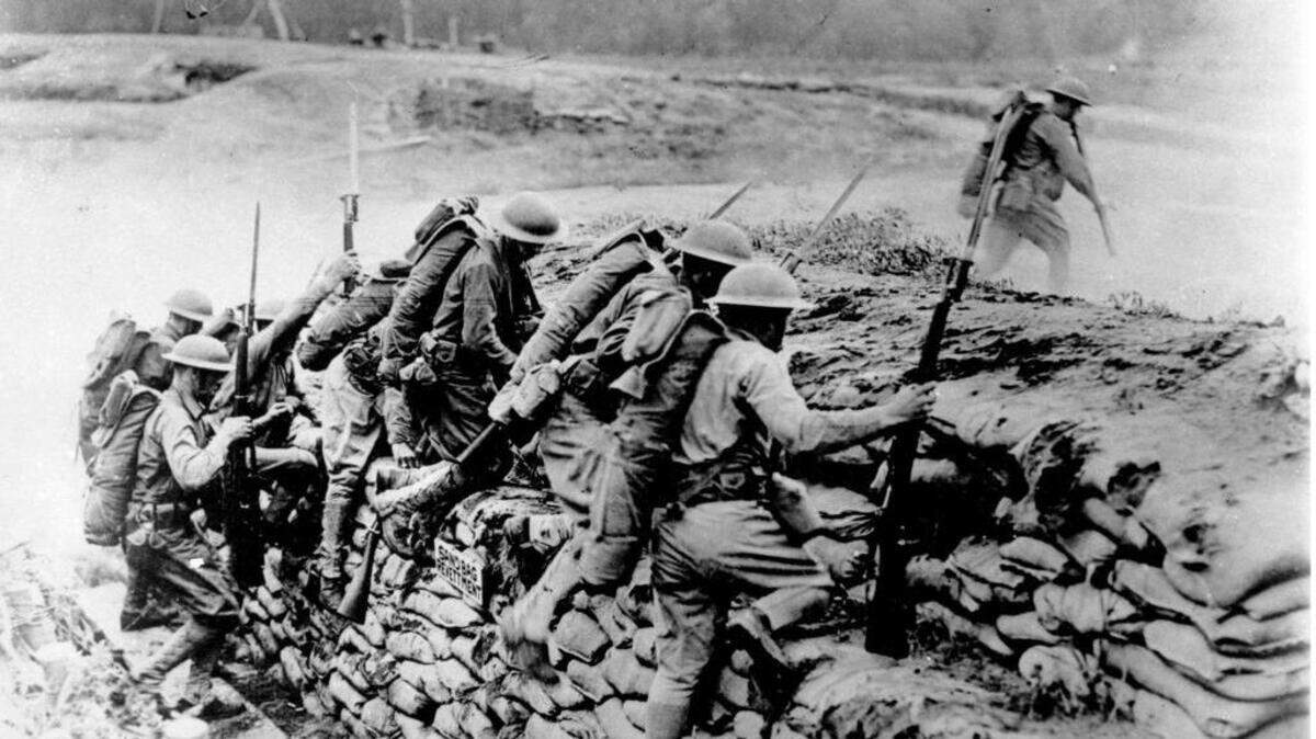 American troops storm a barricade in France during World War I in 1918.