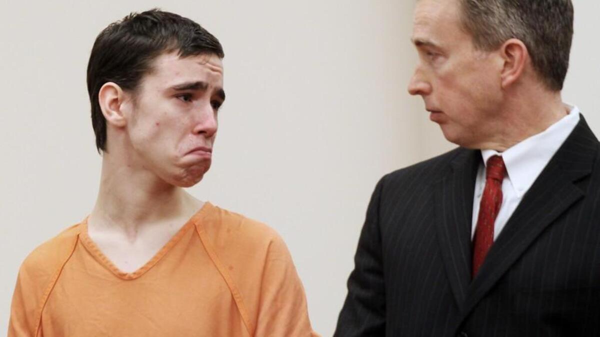 Jacob Matthew Morgan, 17, cries as he listens to a family friend give positive remarks about the teen as he stands next to his attorney B.J. Barrowclough in court Tuesday.