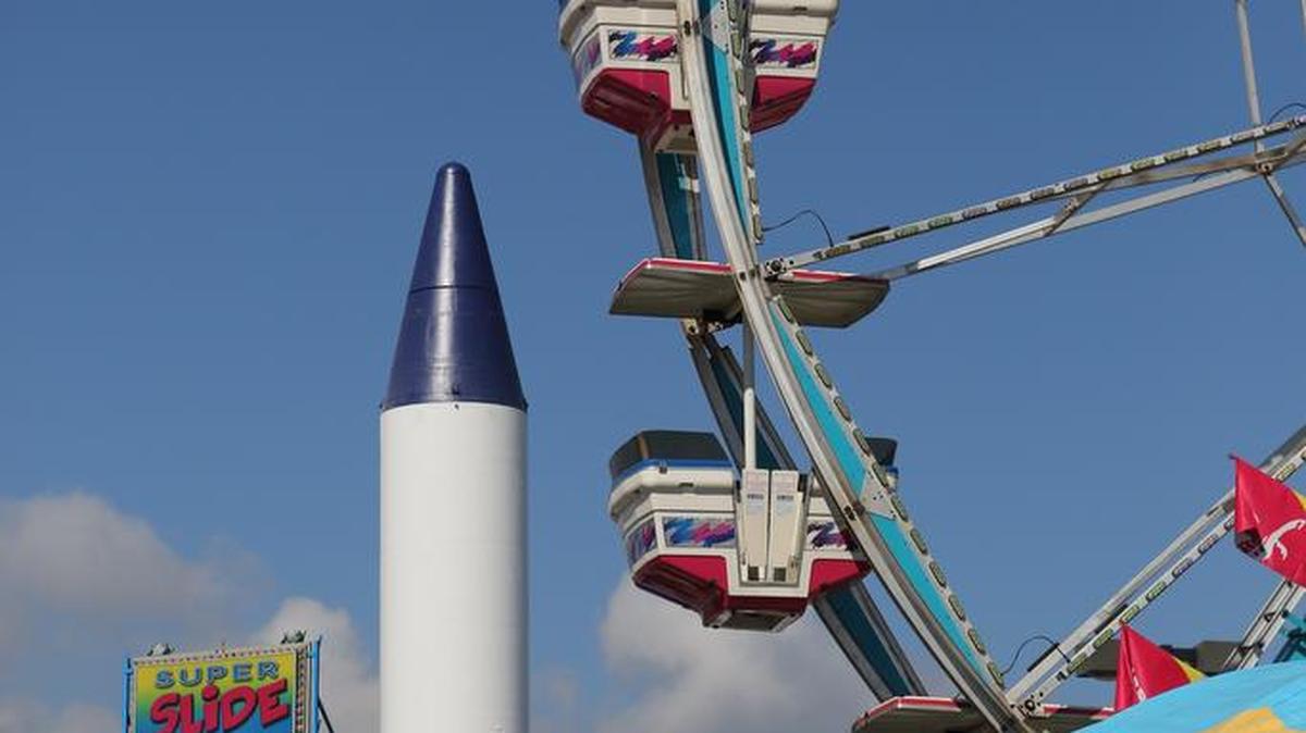 
Workers set up rides and games Monday on the Midway at the South Carolina State Fair. The fair opens Wednesday.
