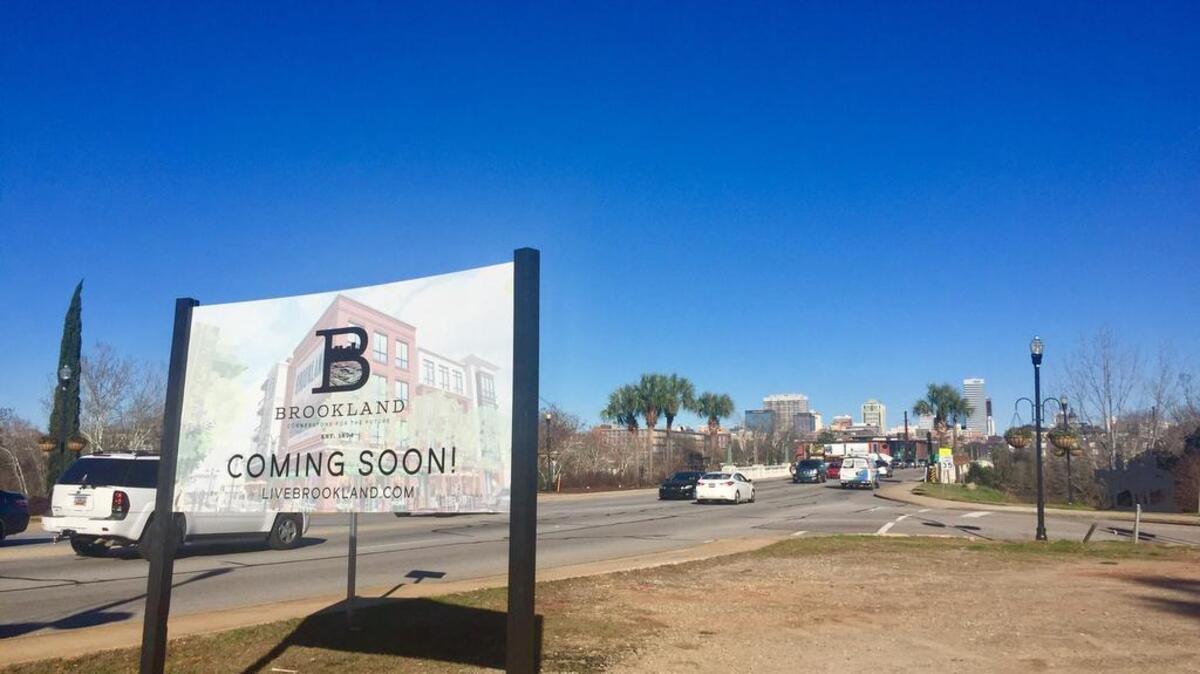 The new Brookland development in West Columbia will contain up to 235 apartments and condominiums as well as stores, restaurants and offices in multi-story buildings overlooking the Congaree River a block east.