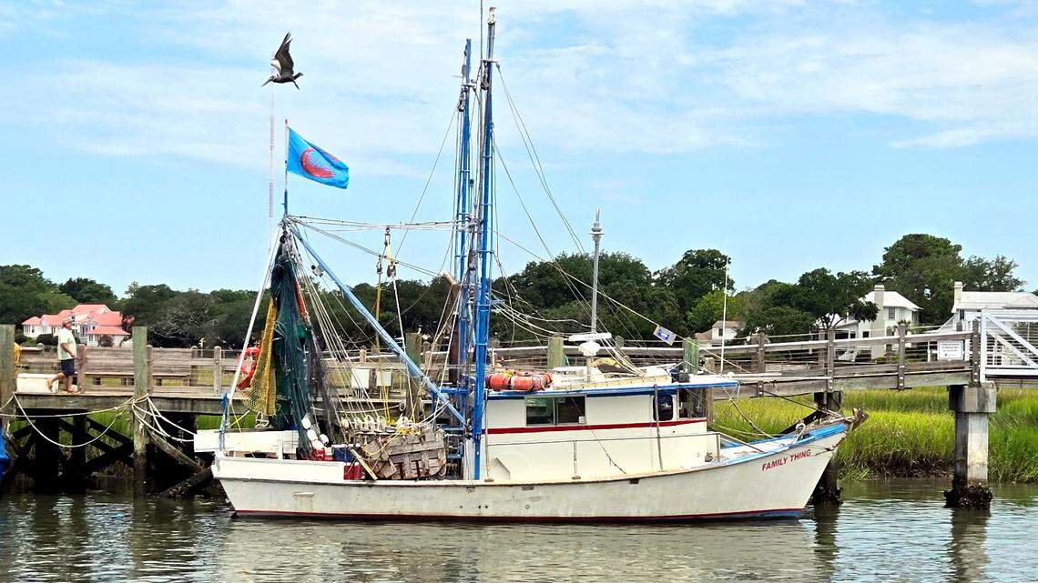 A shrimp trawler sits alone on a dock July 12, 2025 in Mount Pleasant, South Carolina near Shem Creek.