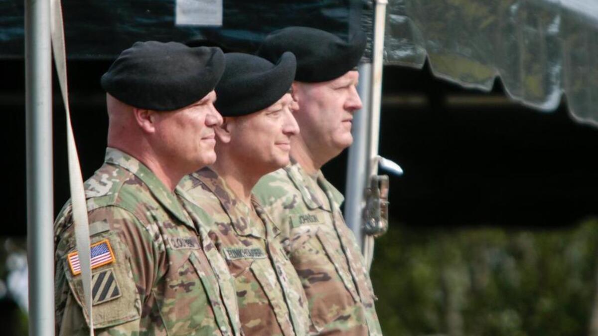 Outgoing base commander, Maj. Gen. Roger Cloutier, Maj. Gen. Anthony Funkhouser and Brig. Gen. John ‘Pete’ Johnson, stand together before a ceremony in which Brig. Gen. Johnson replaced Maj. Gen. Roger Cloutier as base commander.