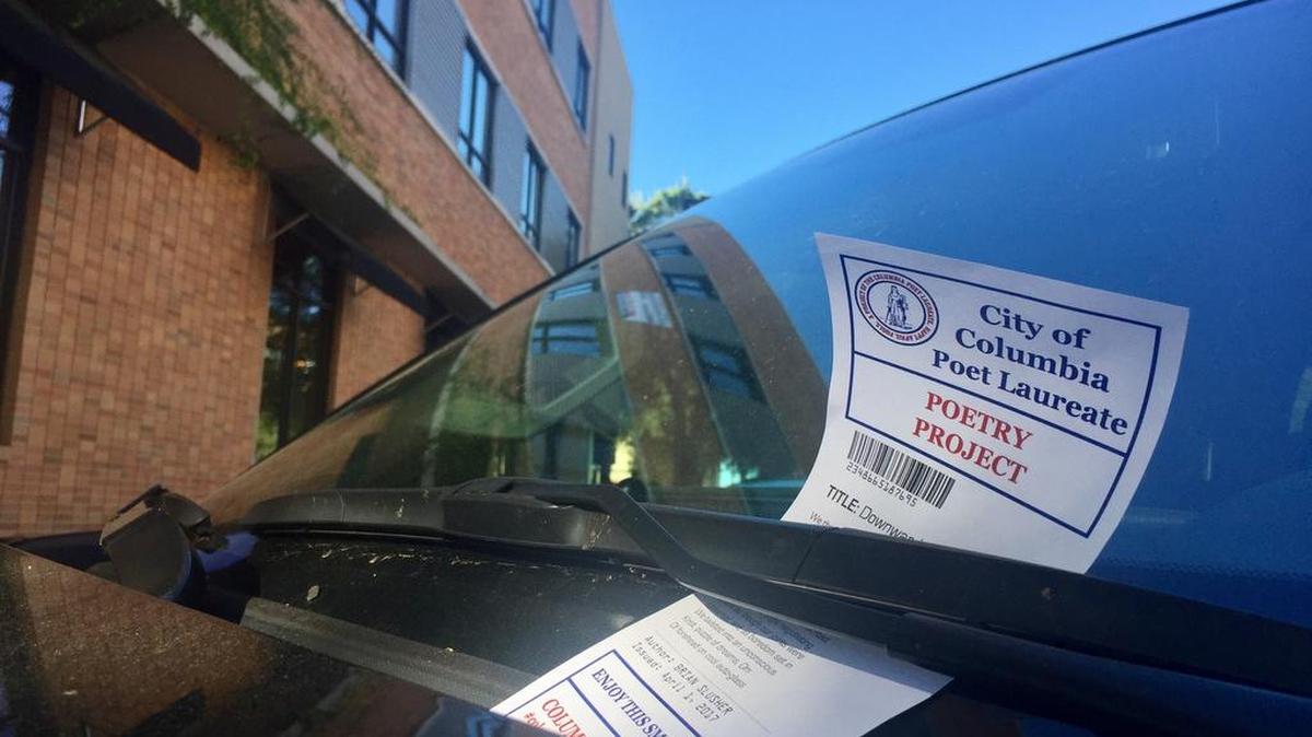 Downtown drivers were surprised to find those dreaded white slips on their windshields Saturday but relieved to see they were poems, not parking tickets.