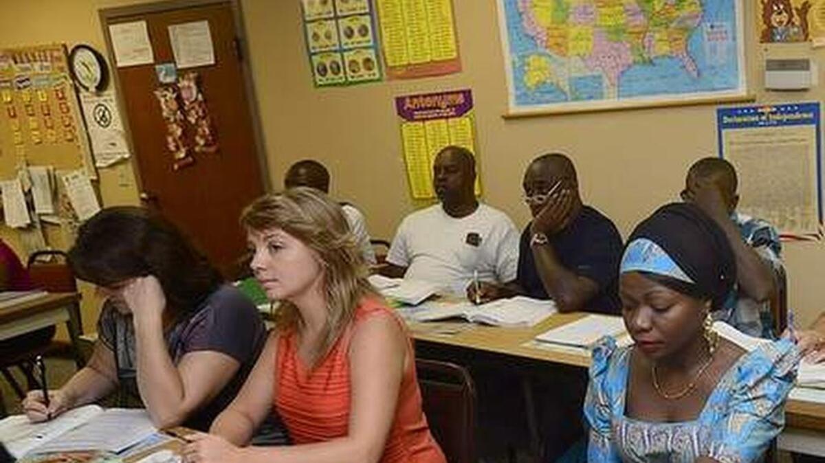
Students attend an English class Tuesday at the Adult Learning Center in Spartanburg. Some of the students are refugees who have recently resettled in Spartanburg. 

