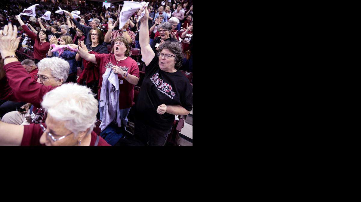 
Gamecock women's basketball fans cheer on their team at the start of the NCAA regional game against Savannah State. 
