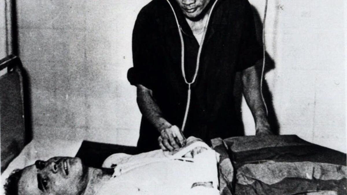 John McCain is administered to in a Hanoi, Vietnam hospital as a prisoner of war in the fall of 1967. McCain spent 20 years in the Navy, a quarter of it in a Vietnamese prisoner of war camp after his jet was shot down over Hanoi during a bombing mission Oct. 26, 1967. The Navy pilot nearly gave up during his captivity but his memory of books and movies helped him survive.