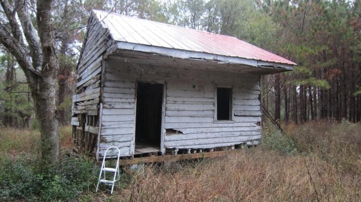 A weatherboard-clad cabin used during slavery at Point of Pines Plantation on Edisto Island circa 1800s.
