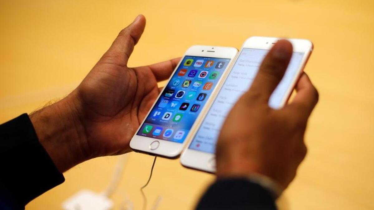 In this Friday, Sept. 25, 2015, file photo, a customer tries out a new Apple iPhone 6S at an Apple store in Chicago. The FBI now says that it may have a way to crack into an iPhone used by one of the San Bernardino shooters, despite previous claims that it could only achieve that with Apple’s help, but it remains unclear exactly how it plans to do that.